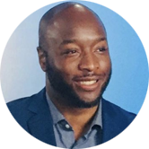 a headshot photograph of Rufus Tony Spann, PhD, LPC in a circular frame